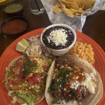 Paco’s Tacos and Tequila signature dishes Wood-Fired FajitasBrisket TacosQueso Fundido